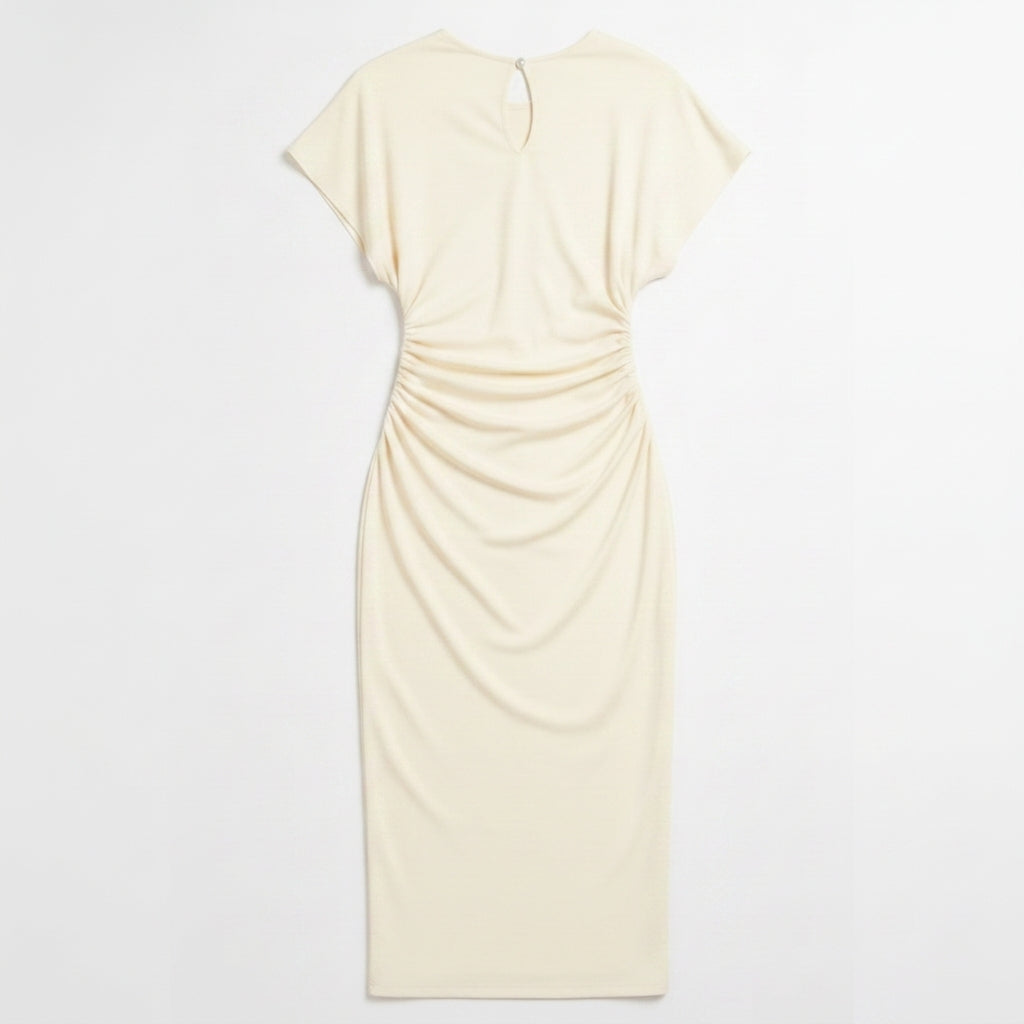 Hero studio shot of the beige/cream midi dress displayed on an invisible mannequin against a uniform seamless #FFFFFF pure white background, crisp studio lighting highlighting the side gathered waist ruching, cap sleeves, and round neckline with keyhole detail.